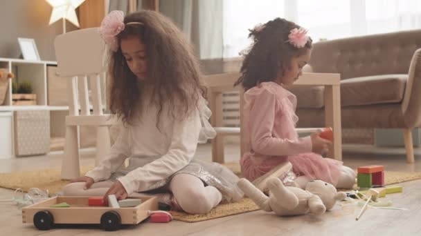 Full Shot Two Adorable Mixed Race Sisters Sitting Floor Living — Stock Video