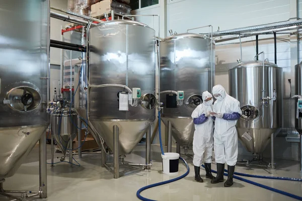 Wide Angle View Two Workers Wearing Protective Suits While Using — Stock Photo, Image