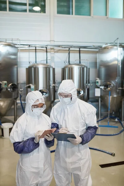 Vertical Portrait Two Young Workers Wearing Hazmat Suits While Using — Stock Photo, Image