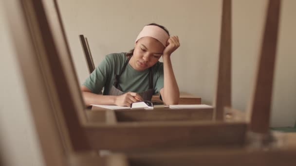 Medium Shot Exhausted Mixed Race Waitress Wearing Uniform Sitting Wooden — Stock Video