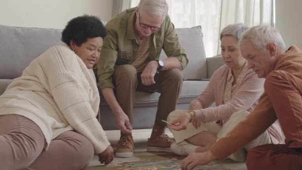 Medium Long Shot Company Diverse Senior Friends Sitting Floor Talking — Stock Video