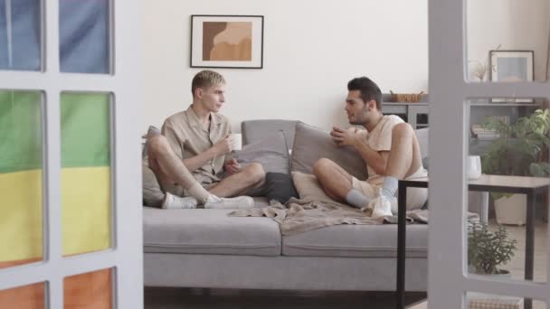 Zoom Two Young Caucasian Men Wearing Casual Clothes Sitting Couch — Stock Video