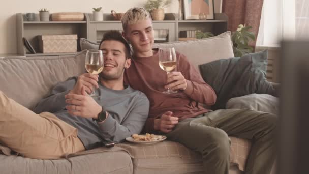 Lockdown Young Caucasian Homosexual Couple Sitting Sofa Living Room Watching — Stock Video