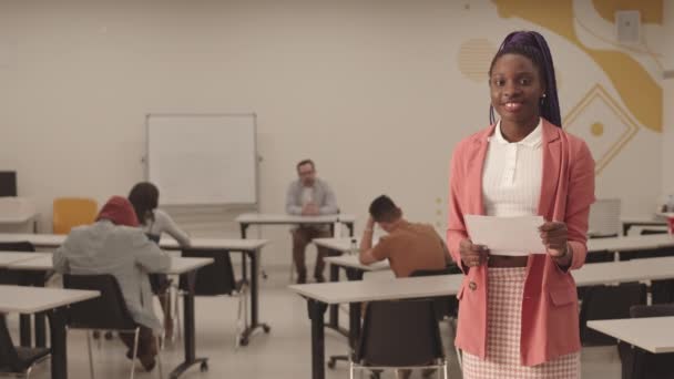 Medium Long Pov African Female Student Wearing Braids Holding Piece — Stock Video