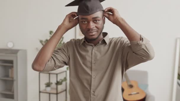 Medium Shot Young African American Man Standing Living Room Putting — Stock Video