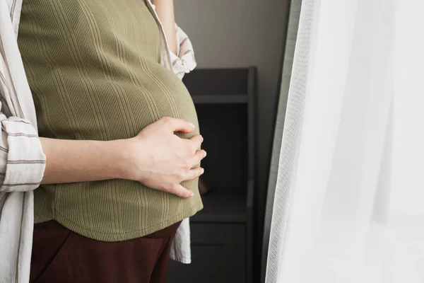 Close Pregnant Woman Touching Belly While Standing Front Window Room — Stock fotografie