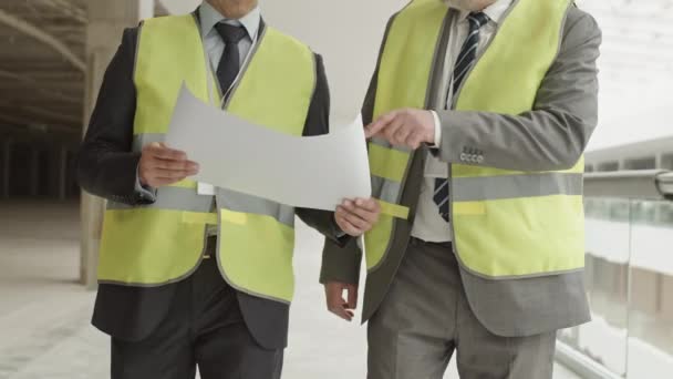 Tracking Shot Two Cropped Unrecognizable Construction Workers Wearing Formal Suits — Vídeo de Stock