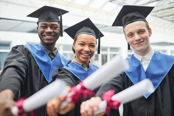 Diverse Group College Graduates Holding Diploma Certificates Smiling Camera Indoors — Stock Photo, Image