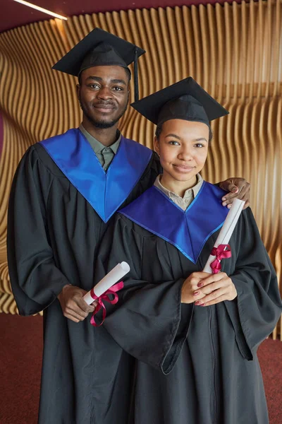 Vertical Portrait Two African American Young People Wearing Graduation Gowns — Stock Photo, Image