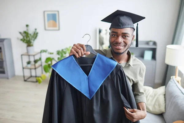 Portrait Happy African American Man Holding Graduation Gown Smiling Camera — Stock Photo, Image