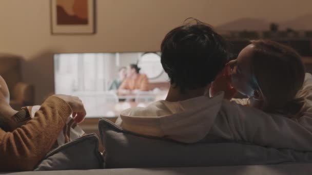 Rear Tracking Left Two Unrecognizable Romantic Couples Hugging Sitting Couch — Stock Video