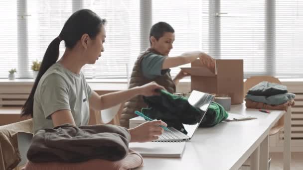 Side View Medium Slowmo Two Diverse Women Sitting Desk Bright — Stock video