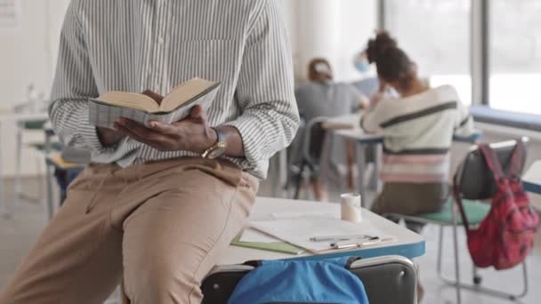 Midsection Slowmo Unidentifiable Male Afro American School Teacher Turning Book — Video