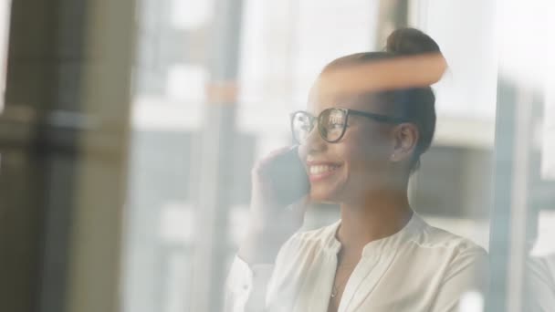 Window Medium Close Slowmo Smiling Young Businesswoman Making Phone Call — Stock Video