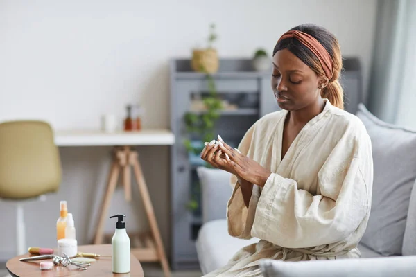 Young African American Woman Using Hand Cream — Stock Photo, Image