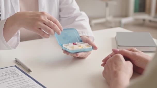 Close Unrecognizable Female Doctor Showing Sick Patient Small Container Pills — Stock Video