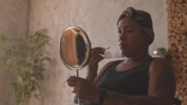 Medium Close Mixed Race Woman Wearing Headband Holding Makeup Mirror — Stock Video