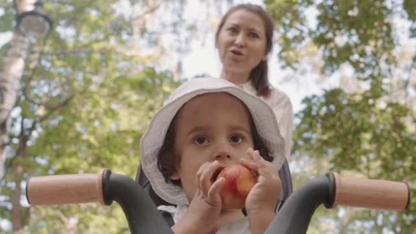 Low Angle Shot Cute Toddler Boy Curly Brown Hair Eating — Αρχείο Βίντεο