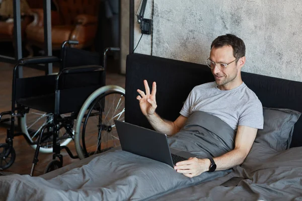 Man with Disability Using Video Chat at Home — Stock fotografie