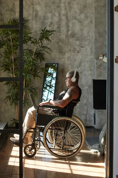 Modern Woman in Wheelchair Listening to Music — Stock Fotó