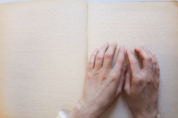 Hands Reading Braille