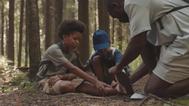 Slowmo Shot African American Boy Resting Forest Ground Having Injured — Stock Video