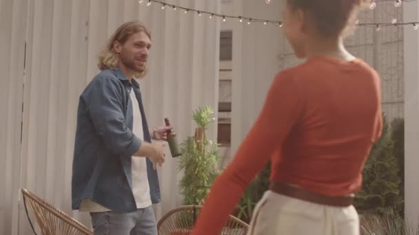 Medium Shot Cheerful Young Caucasian Man Bottle Beer Greeting His — Stock Video