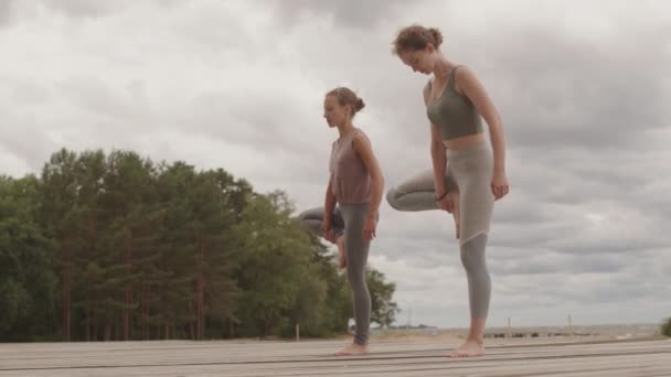 Low Angle Full Length Slowmo Shot Two Young Healthy Women — Stockvideo