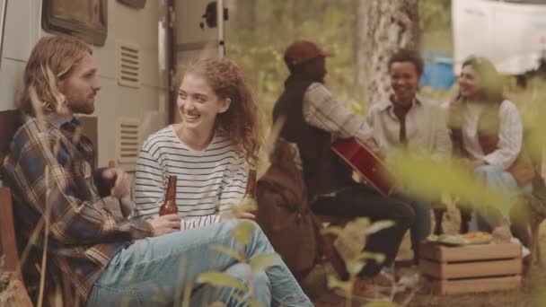 Slowmo Shot Young Cheerful Couple Chatting Drinking Beer Sitting Outdoors — Stock Video