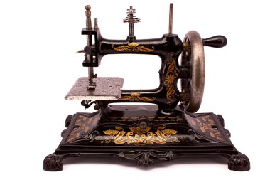 Antique sewing machine on white background 
