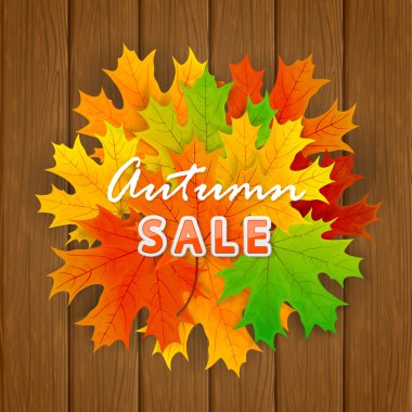 Ahşap arka plan üzerinde yazıt sonbahar satış ve akçaağaç yaprağı