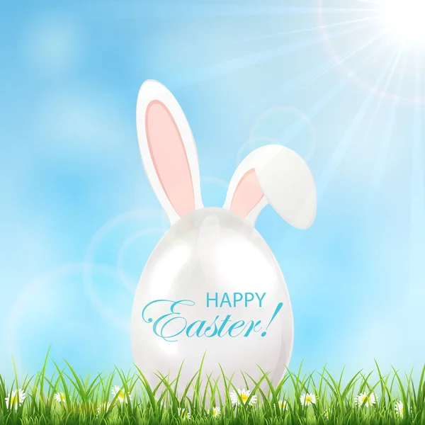 Easter egg met oren in een gras — Stockvector