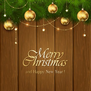 Ahşap zemin üzerine altın Noel süsleri