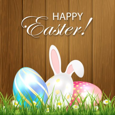 Parlak yumurta ve tavşan ahşap adam'Paskalya arka plan