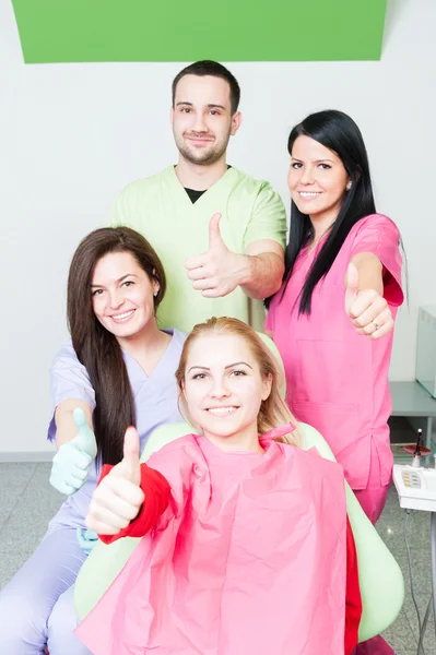 Successful dentist team and happy patient — Stock Photo, Image