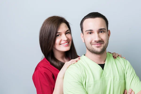Dentist team or couple on gray copy space — Stock Photo, Image