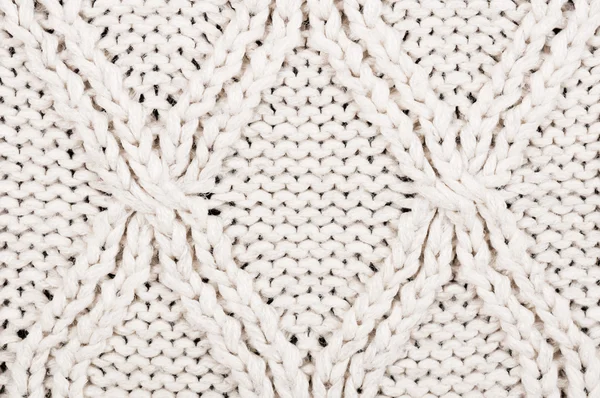 Close-up of beige knitted winter sweater with pattern — Stock Photo, Image