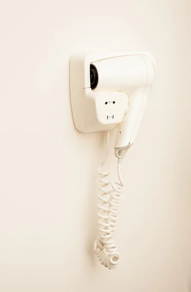 White dryer hanging on wall at locker room — Stockfoto