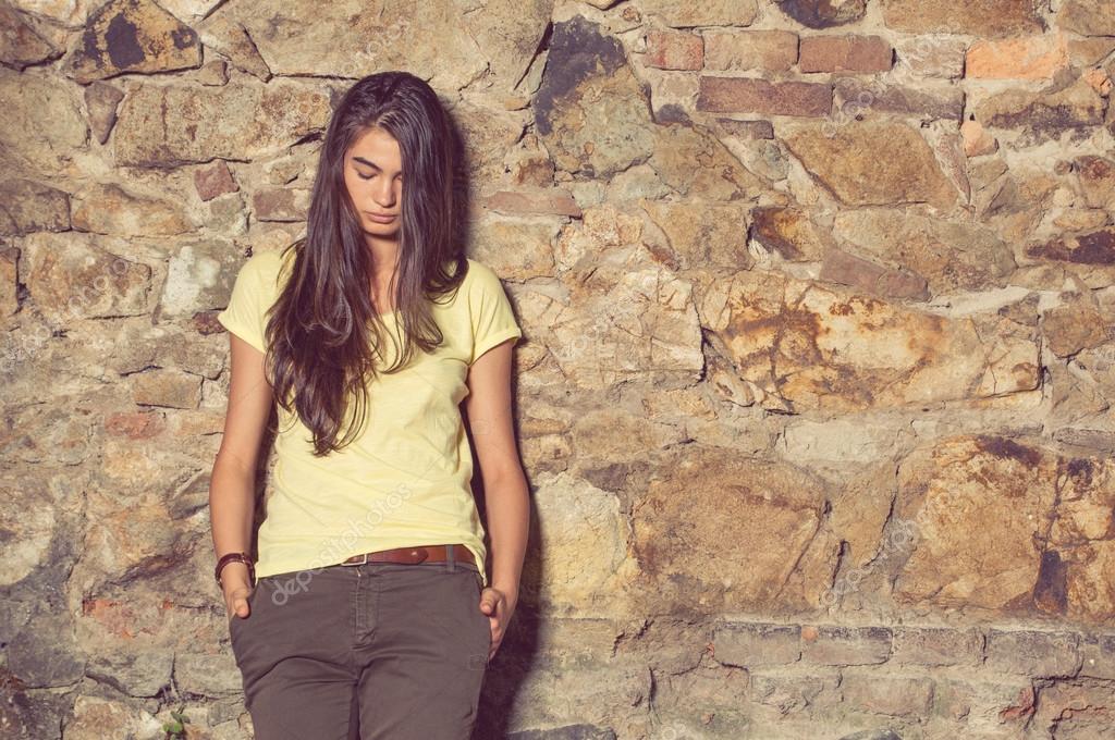 yellow shirt and brown pants