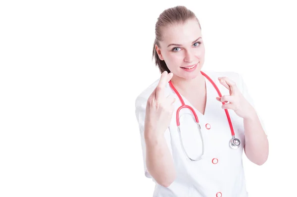 Female doctor crossed her fingers on a white background — Stock Photo, Image