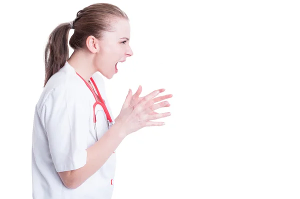 Furious female doctor model screaming with mouth wide open — Stock Photo, Image