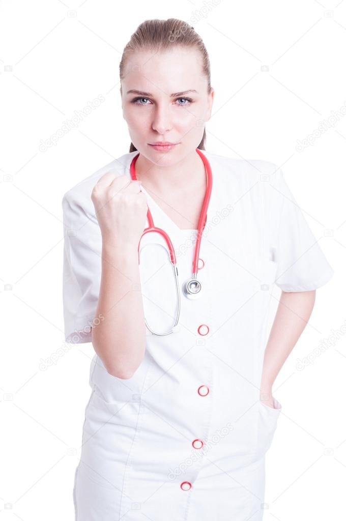 Furious and frustrated woman doctor showing threatening  fist 