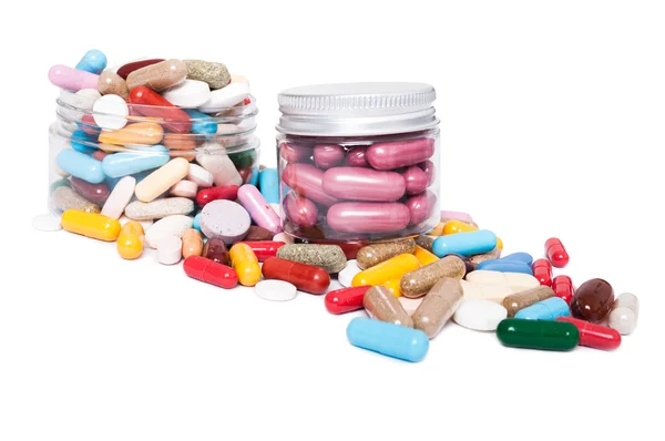 Frascos o recipiente con muchas píldoras de color — Foto de Stock