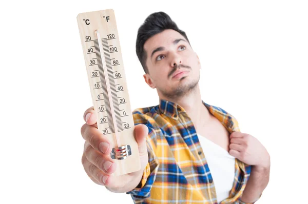 Closeup portrait of male holding a heat measurement instrument — Stock Photo, Image