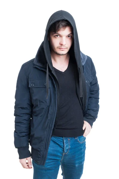 Handsome trendy male wearing hooded sweatshirt, black jacket and — Stock Photo, Image