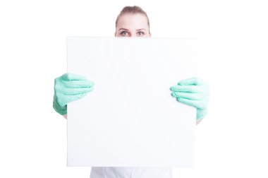 Woman nurse or doctor showing blank or empty  board