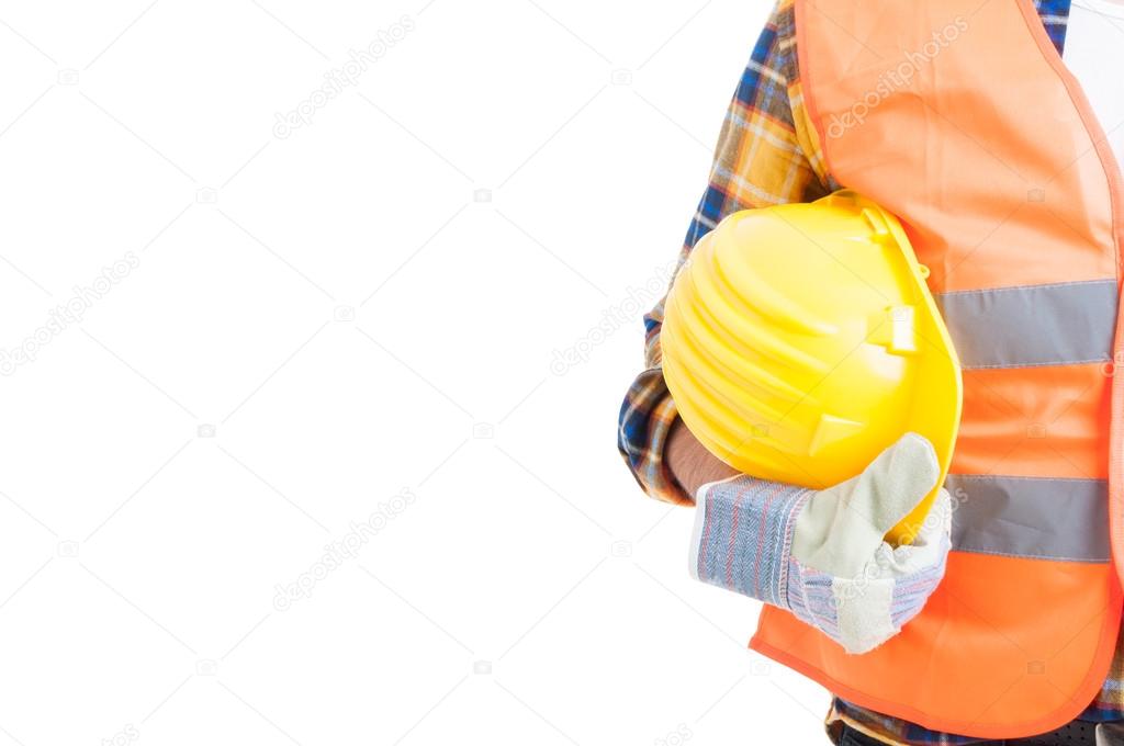 Close-up workwear and helmet in engineer or constructor hand