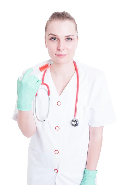 Healthcare and medicine concept with young doctor holding a syri — Stock Photo, Image