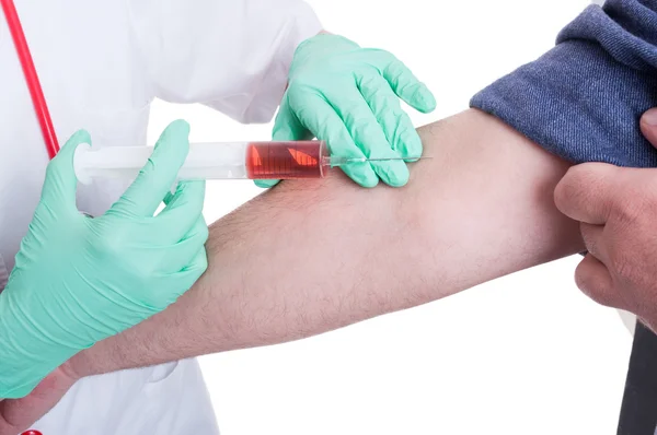 Medical doctor makes an injection to a male patient — Stock Photo, Image