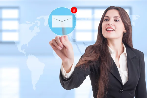 Mujer de negocios presionando el botón futurista sobre el correo electrónico en Tran —  Fotos de Stock